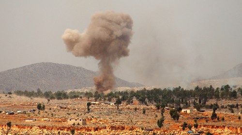Smoke billows from a reported Russian airstrike near the village of Hafsarjah, in the western ...