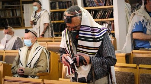 Jewish men pray at synagogue in the Jewish settlement of Efrat, Gush Etzion, May 20, 2020. Photo by ...