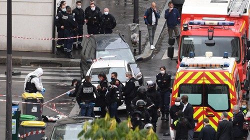French police and forensic officers inspect the scene of an attack after several people were injured ...
