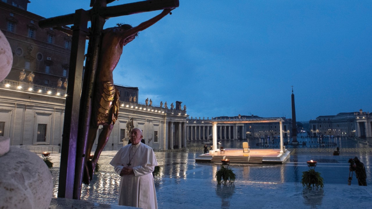 27 March 2020: historic moment of prayer presided over by Pope Francis on the parvis of St Peter’s Basilica with the empty square plunged into an unreal silence, but followed by Catholics, and many others, from around a world threatened by the spread of covid-19. The Pontiff praying in front of the crucifix of St Marcellus, which the Romans once carried in procession against the plague (© Vatican Media)
