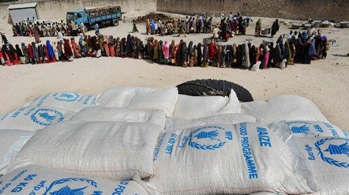 (FILES) In this file photo taken on August 15, 2011 Somali people living in nearby camps for ... (FILES) In this file photo taken on August 15, 2011 Somali people living in nearby camps for ...