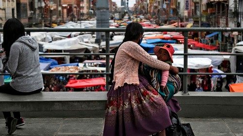 An indigenous woman looks at the 16 de Julio market in El Alto, Bolivia, on October 15, 2020, ahead ...