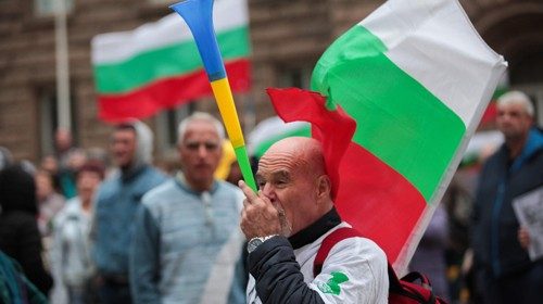 A demonstrator participates in an anti-government protest near the parliament building in Sofia on ...