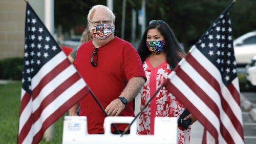 FILE PHOTO: People arrive to cast their ballots just after sunrise during early voting in ...