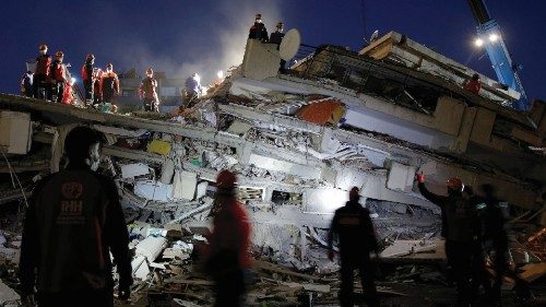 Rescue operations take place on a site after an earthquake struck the Aegean Sea, in the coastal ...