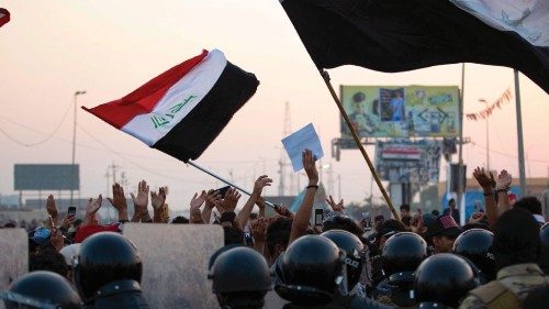 Iraqi anti-government protesters confront security forces as the latter attempt to break up a ... Iraqi anti-government protesters confront security forces as the latter attempt to break up a ...