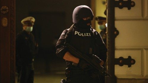 A police officer stands guard in front of the Interior Ministry as a news conference takes place ...