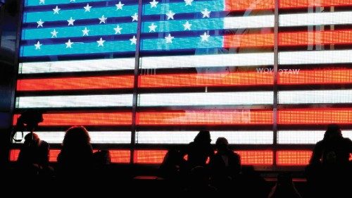 People watch election results in Times Square in New York, early November 4, 2020. (Photo by TIMOTHY ...