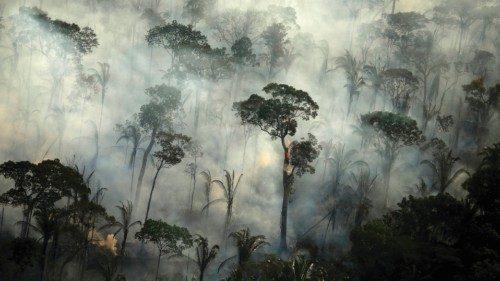 FILE PHOTO: Smoke billows during a fire in an area of the Amazon rainforest near Porto Velho, ...