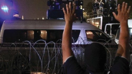 A demonstrator gestures towards police, during a rally to call for the ouster of Prime Minister ... A demonstrator gestures towards police, during a rally to call for the ouster of Prime Minister ...
