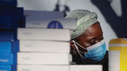 A healthcare worker prepares to administer tests for the coronavirus disease (COVID-19), as the ...