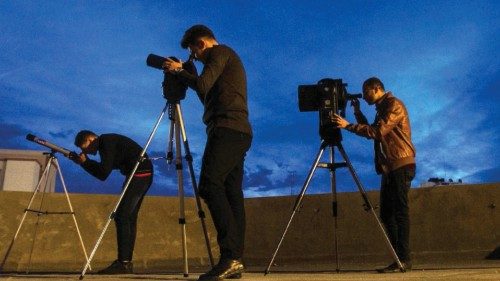 Ibrahim Saad, (c) a telescope expert, and education engineer with Mohammad Baraka (R) , the son of ...