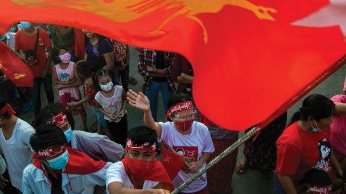 Supporters of the National League for Democracy (NLD) party celebrate in Yangon on November 10, ...