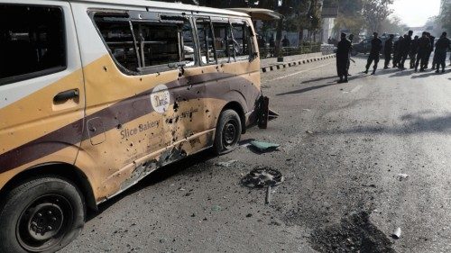 Police officers stand guard after rockets hit residential areas in Kabul, Afghanistan November 21, ...