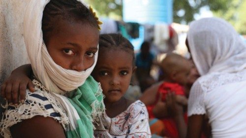 Refugees from the Tigray region of Ethiopia region wait to register at the UNCHR center at Hamdayet, ...