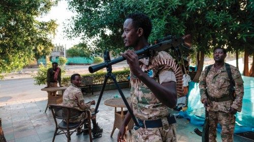 A member of the Amhara Special Forces holds a machine gun at an improvised camp in the front of a ...