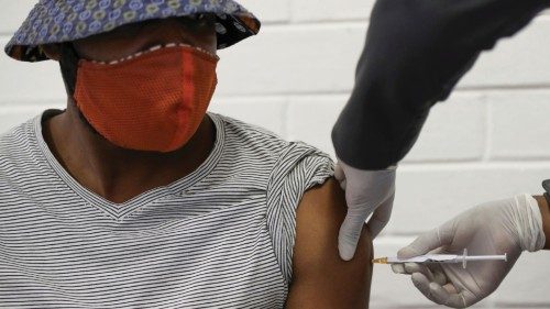 FILE PHOTO: A volunteer receives an injection from a medical worker during the country's first human ...