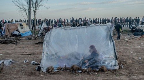 -- AFP PICTURES OF THE YEAR 2020 --

A Syrian woman sits in a tent with her son as others wait for ...