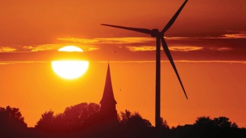 FILE PHOTO: A power-generating windmill turbine is pictured during sunset at a renewable energy park ...