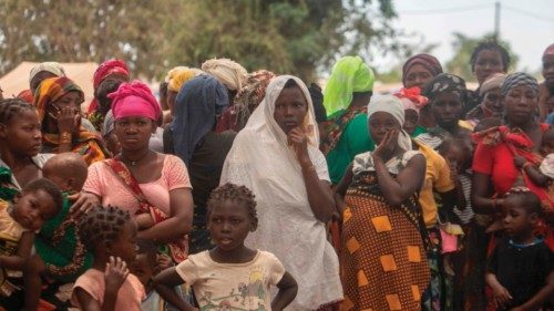 TOPSHOT - Displaced women attend a meeting on December 11, 2020 at the Centro Agr?rio de Napala ...