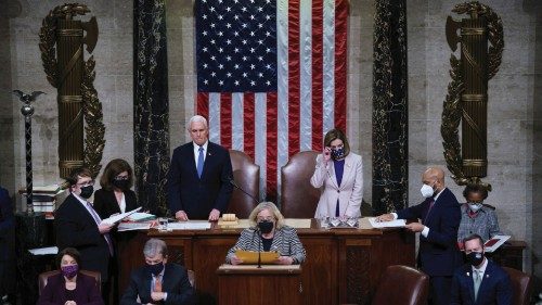 U.S. Vice President Mike Pence and Speaker of the House Nancy Pelosi (D-CA) prepare to read the ...