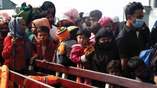 epa08909420 A group of Rohingya refugees onboard in a naval ship as they arrive in Bhashan Char ...