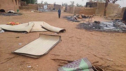 epa08918741 A boy from Niger walks in the village of Tchombangou following a deadly attack which ...