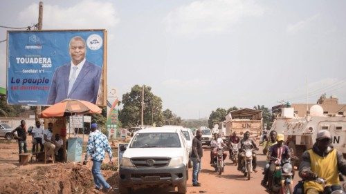 A poster for the outgoing Central African Republic Faustin Archange Touadera, enthroned on a street ...