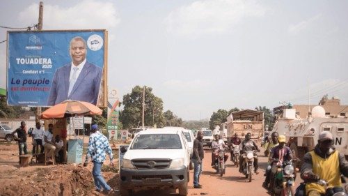A poster for the outgoing Central African Republic Faustin Archange Touadera, enthroned on a street ... A poster for the outgoing Central African Republic Faustin Archange Touadera, enthroned on a street ...