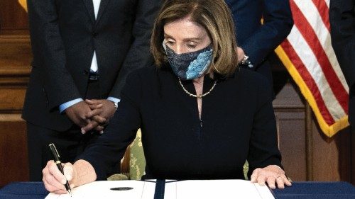 WASHINGTON, DC - JANUARY 13: Speaker of the House Nancy Pelosi (D-CA) signs an article of ...