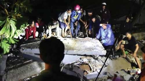 EDITORS NOTE: Graphic content / Rescuers search for survivors at a collapsed building in Mamuju city ... EDITORS NOTE: Graphic content / Rescuers search for survivors at a collapsed building in Mamuju city ...