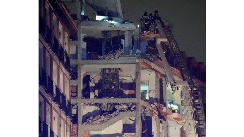 Firefighters work after a deadly explosion at a building belonging to the Catholic Church in Madrid ... Firefighters work after a deadly explosion at a building belonging to the Catholic Church in Madrid ...