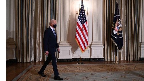 US President Joe Biden arrives to swears in presidential appointees during a virtual ceremony in the ...