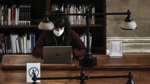 A student studies sitting apart due to the coronavirus, Covid-19, in the historical library at the ...