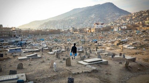 epaselect epa08968870 A boy searches for customers to sell water while walking across Kart-e Sakhi ...