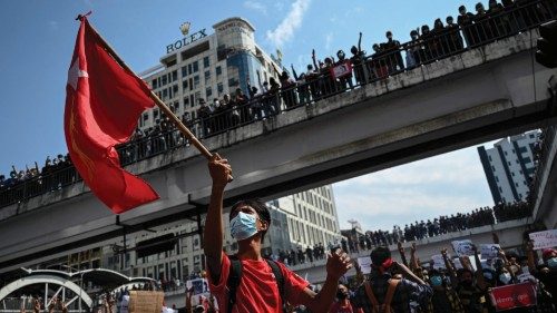 TOPSHOT - Protesters gather to demonstrate against the February 1 military coup, in downtown in ... TOPSHOT - Protesters gather to demonstrate against the February 1 military coup, in downtown in ...