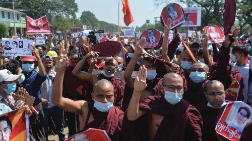 Buddhist monks march during a demonstration against the military coup in Naypyidaw on February 13, ...
