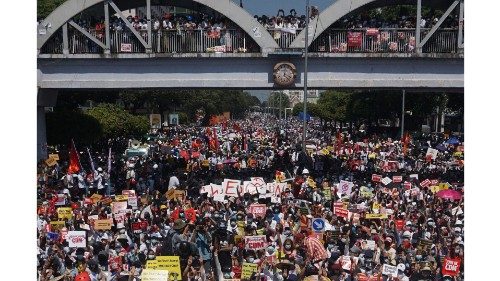 Protesters block a major road during a demonstration against the military coup in Yangon on February ...