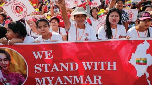 People gather to rally in support of Myanmar State Counsellor Aung San Suu Kyi before she heads off ...