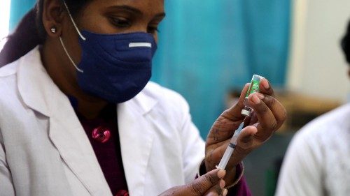 epa09025539 A health worker prepares a shot of COVID-19 vaccine during the vaccination drive at Jai ...