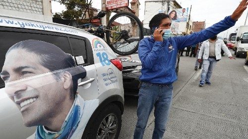 epa09028446 Ecuadorian indigenous presidential candidate Yaku Perez waves to supporters as he leads ...