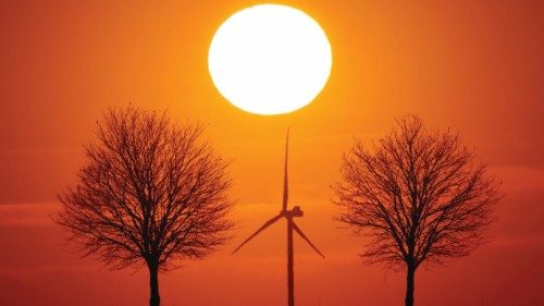 Power-generating windmill turbines are seen during sunset in Bourlon, France, February 23, 2021. ...
