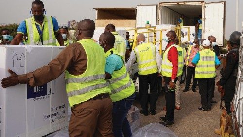 epa09034890 A handout photo made available by UNICEF showing workers load to a refrigerator truck ...