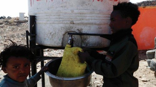 epa09045446 Displaced Yemeni children collect water from a water tank at a camp for Internally ...