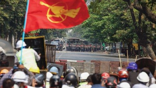 TOPSHOT - Protesters face off with police during a demonstration against the military coup in ...