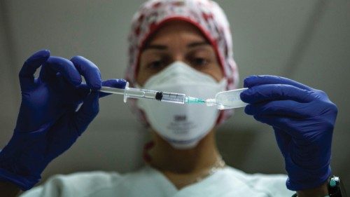 epa09048673 A nurse prepares a Pfizer COVID-19 vaccine dose at a public health center during the ...