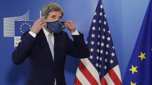 epa09063907 US Special Presidential Envoy for Climate John Kerry puts his face mask on after a ...