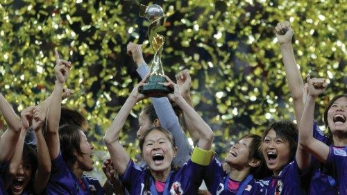 Japan's players celebrate with the trophy after winning their Women's World Cup final soccer match ...