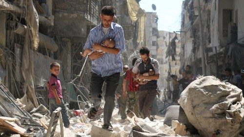 (FILES) In this file photo taken on September 11, 2016, Syrian men carrying babies make their way ...
