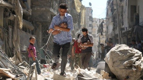 (FILES) In this file photo taken on September 11, 2016, Syrian men carrying babies make their way ... (FILES) In this file photo taken on September 11, 2016, Syrian men carrying babies make their way ...